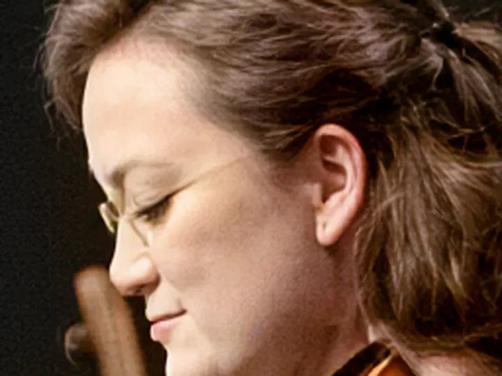 MegaPotato: a musician with thin wire glasses, heavy JPEG