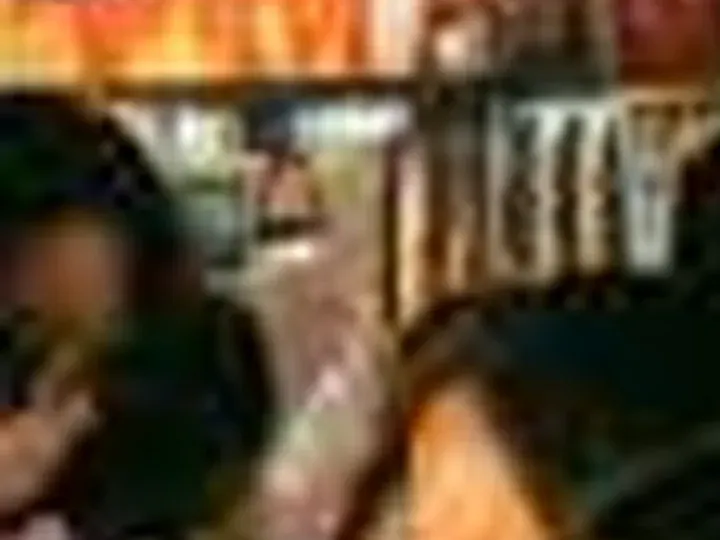 What every tool got: a 56 × 42 px detail of the night market photo