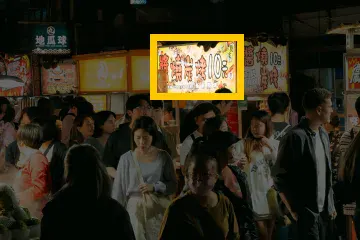 Where the detail is in the whole photo: Night market: a 112 × 72 px detail of the 504 × 336 px input.