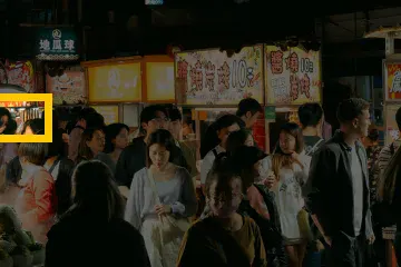 Where the detail is in the whole photo: Night market: a 56 × 42 px detail of the 504 × 336 px input.