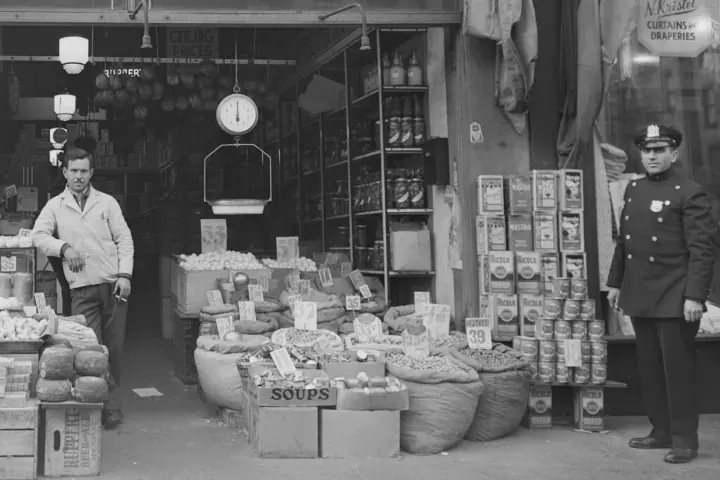 Grocery store, 1943 · old photo (1943), signs + people
